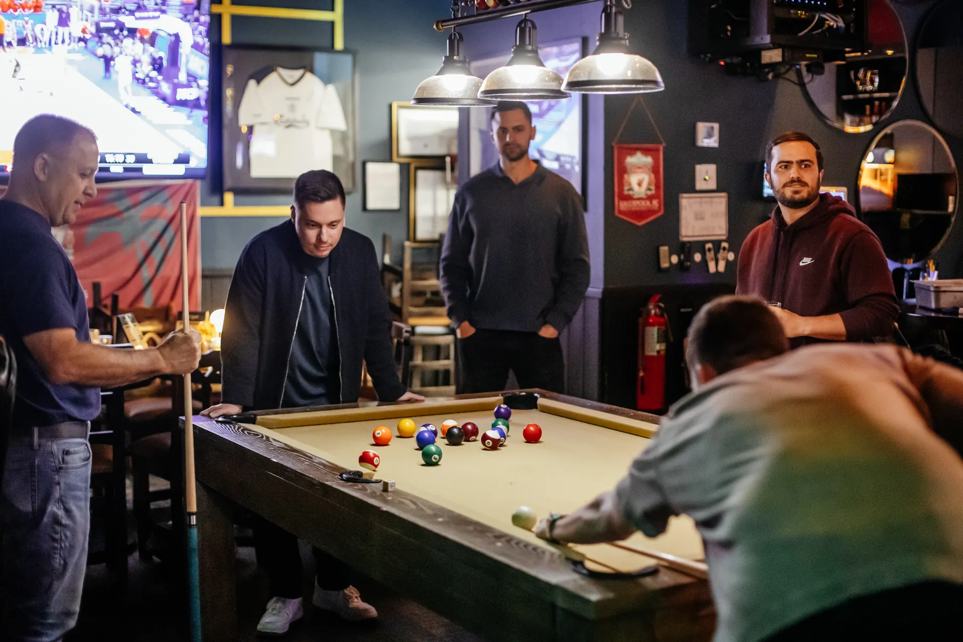 Pool table and screens at Mickey Burkes